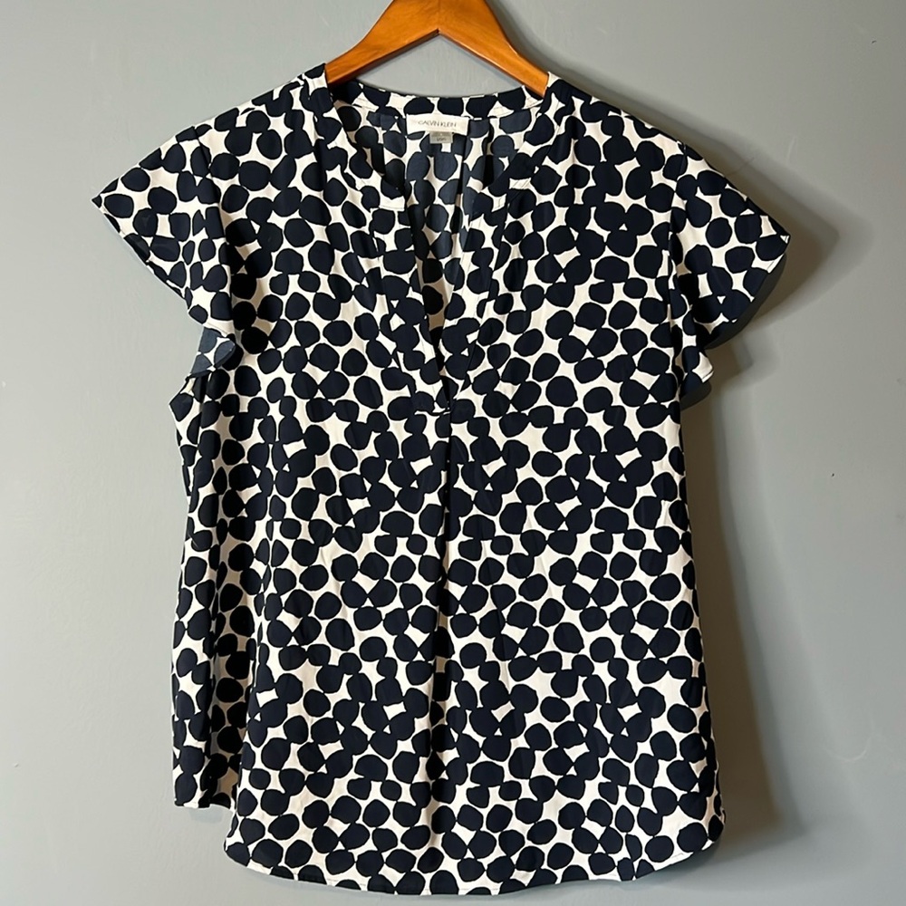 Calvin Kline blue and white woman’s top. Size L